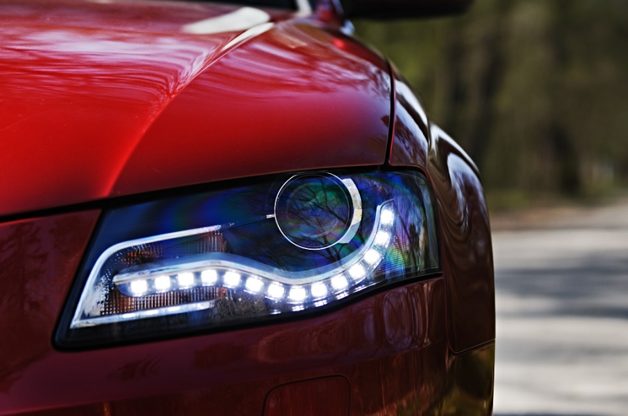 Red sports car with LED accent headlights